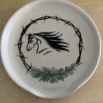 spoon rest pottery with horse, barbed wire, and sage on as the design element